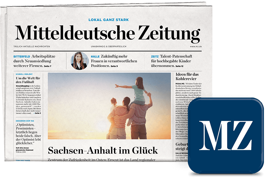 Front page of Mitteldeutsche Zeitung showing a sunset family photo and the headline Sachsen-Anhalt im Glück