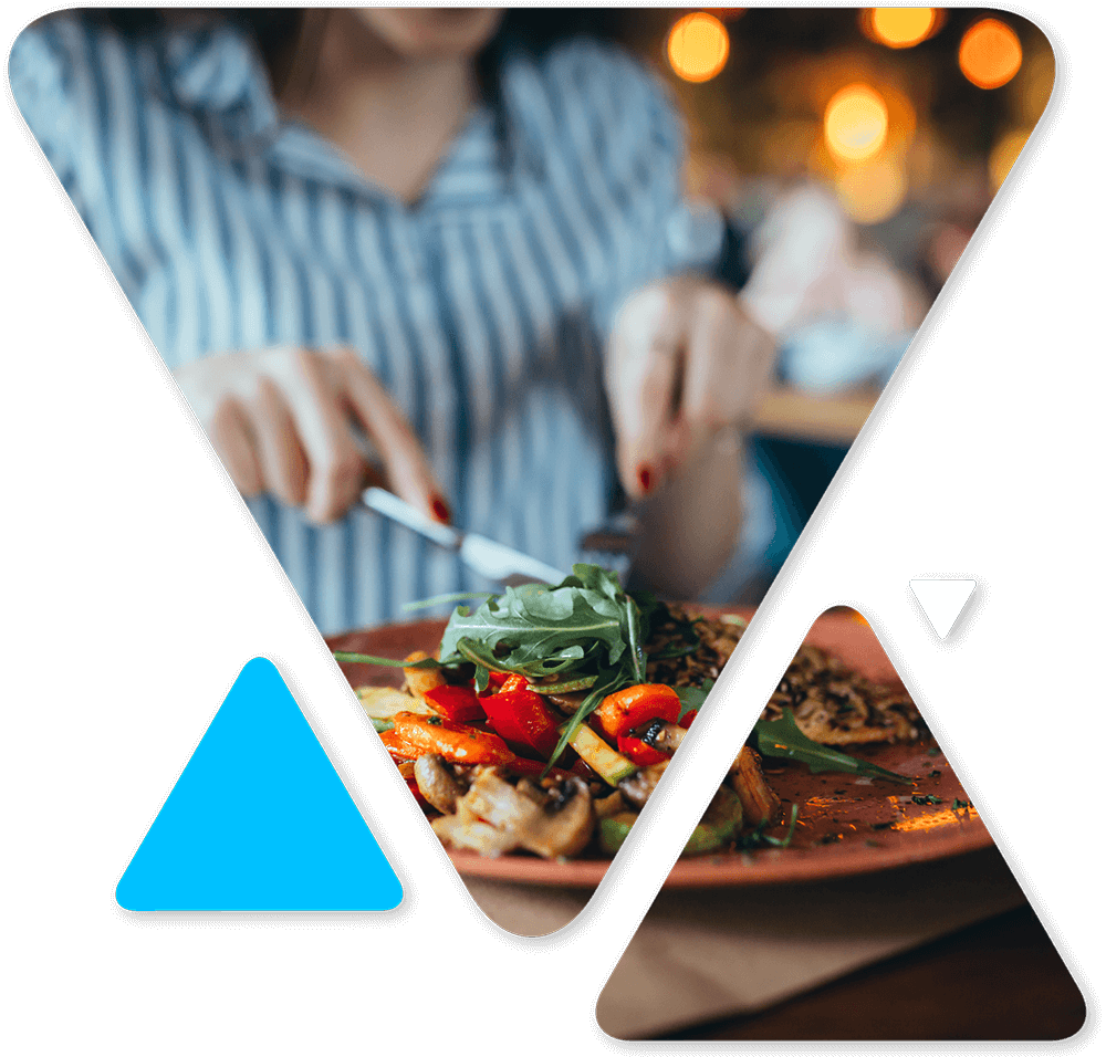 Person in a striped shirt slicing a colorful vegetable dish at a restaurant; geometric blue shapes overlay the image.