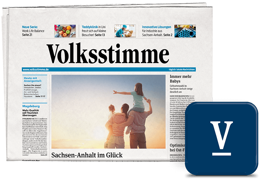 Front page of Volksstimme newspaper showing a sunset family photo and the headline 'Sachsen-Anhalt im Glück', with a blue V app icon in the corner.